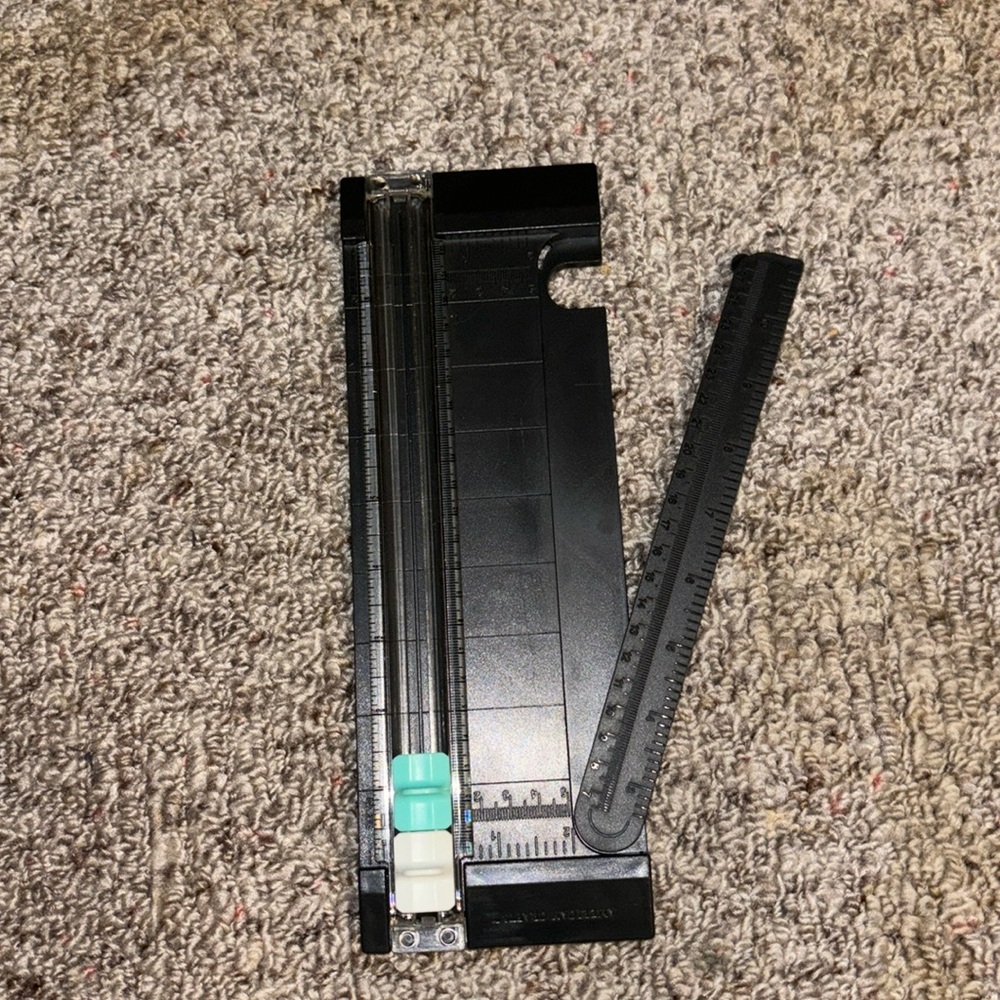 Push down paper trimmer.